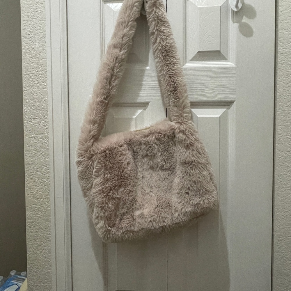 Cozy furry tote/ purse very roomy new never used.